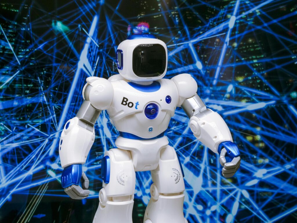 Humanoid robot labeled “Bot” standing against a futuristic digital network background with glowing blue connections