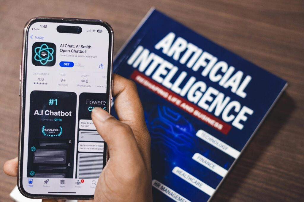Photo of a computer screen showing attachment details with an image about artificial intelligence, reflected in a room with people in the background