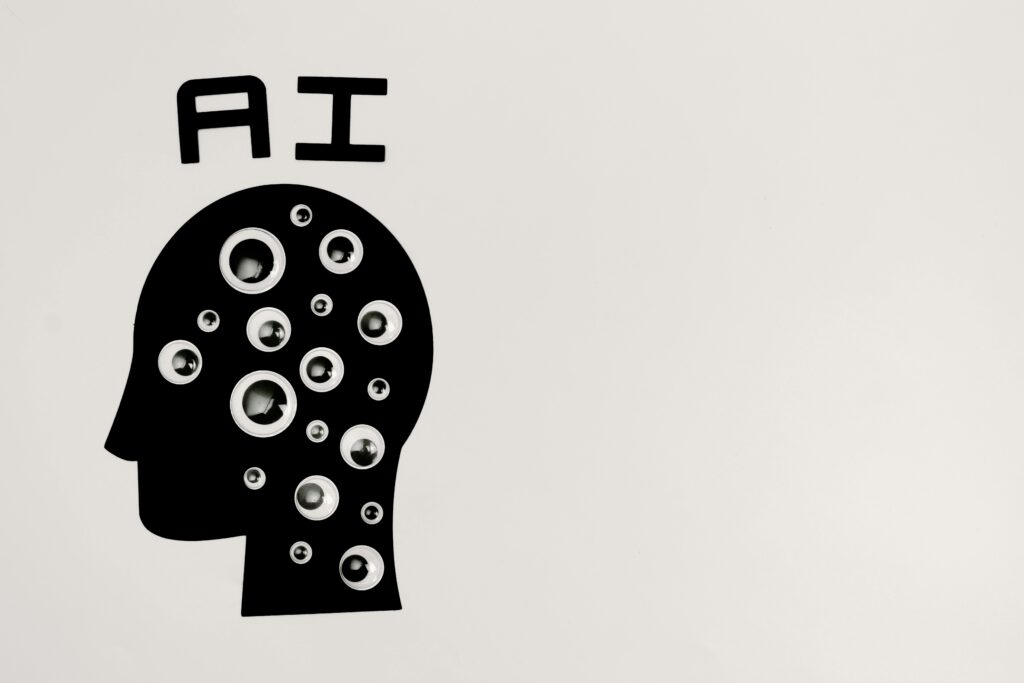 Ai chat tools 
Black silhouette of a human head filled with circular patterns, with the text “AI” above it on a plain background